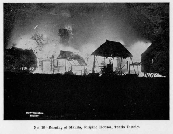 Pemandangan malam hari dari pembakaran Manila, dengan rumah-rumah Filipina yang terbakar